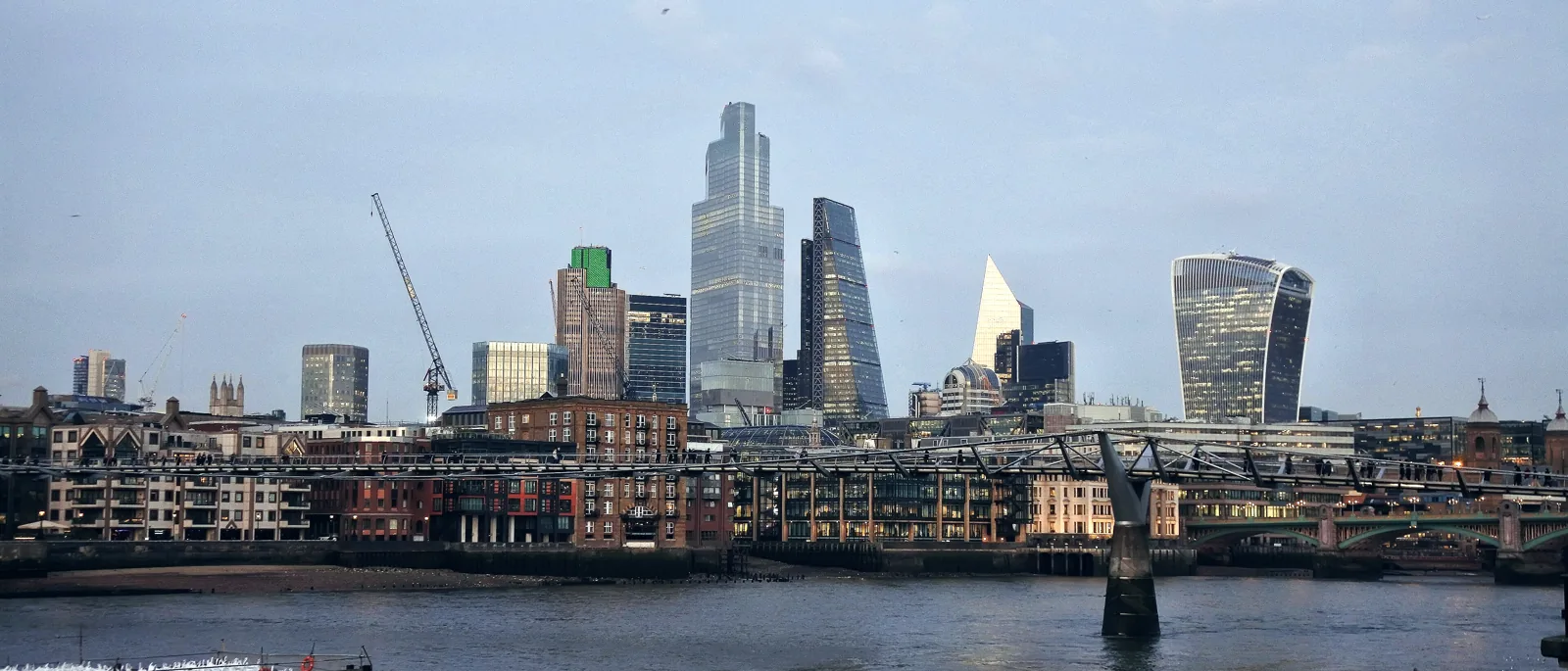The City of London skyline at dusk seen across the Thames